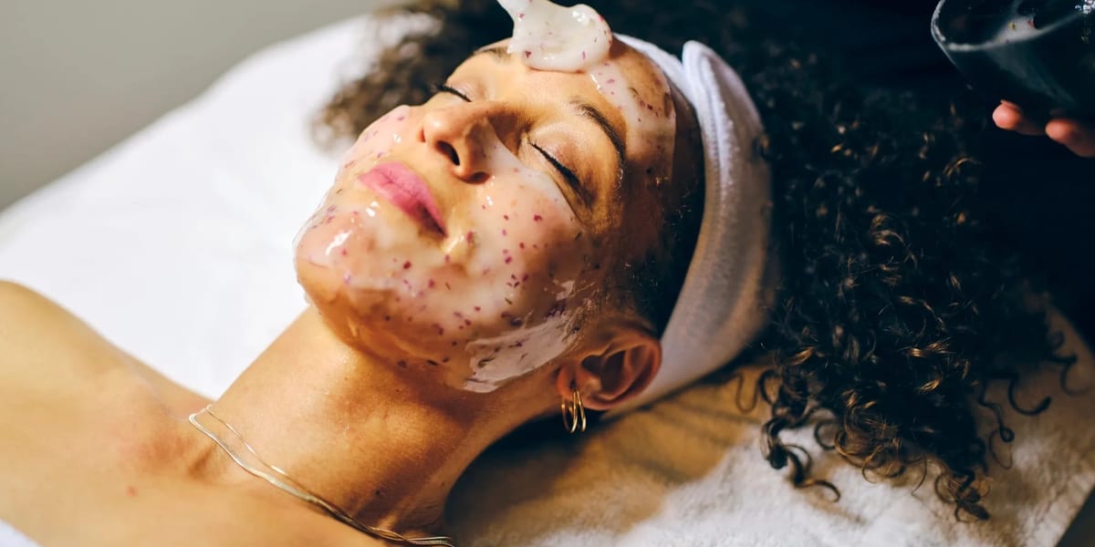 Woman relaxing during facial mask spa treatment